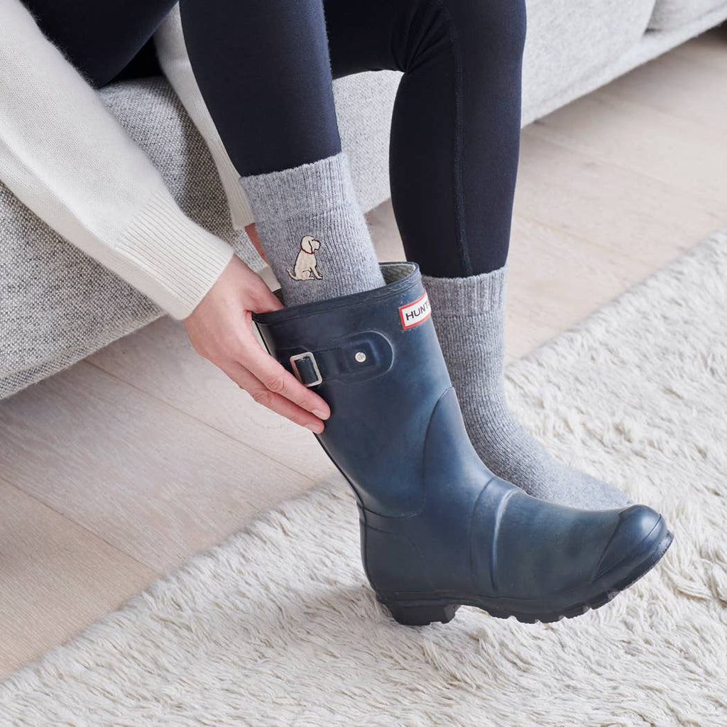 Person wearing Hunter Wellingtons and our Dog embroidered wool socks