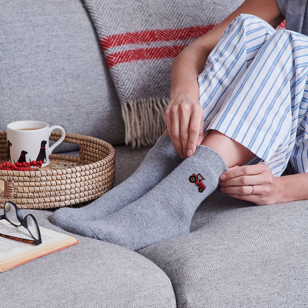Grey Woollen socks with embroidered tractor design.